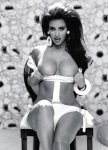 Kim-Kardashian-in-black-and-white-photo-pulling-her-top-down-and-showing-off-her-big-boobs.jpg