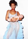 Rihanna-In-Topless-And-See-Through-Dress-Holding-A-Baby.jpg